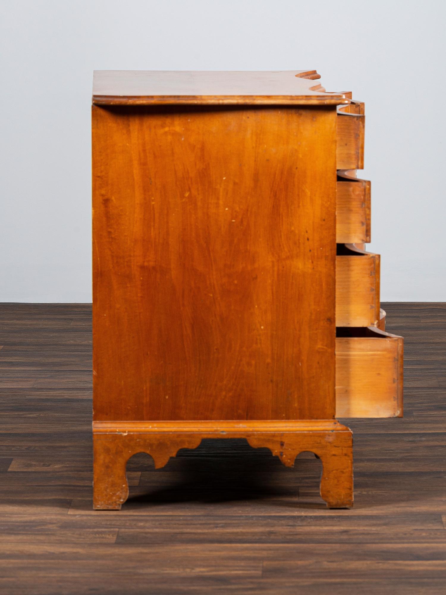 A Chippendale Style Tiger Maple Serpentine Chest of Drawers