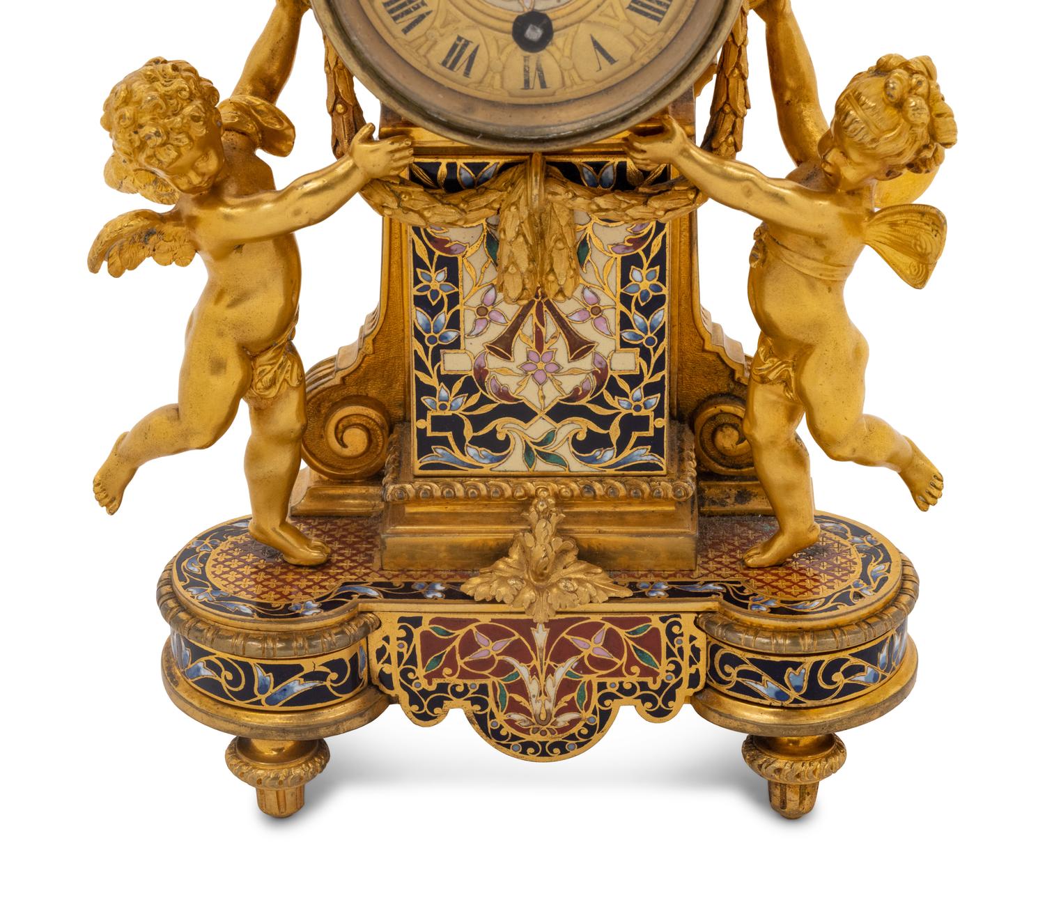 A French Gilt Bronze and Champlevé Figural Mantel Clock