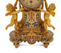 A French Gilt Bronze and Champlevé Figural Mantel Clock