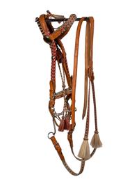 A Group of Western Horse Bridles and Quirts