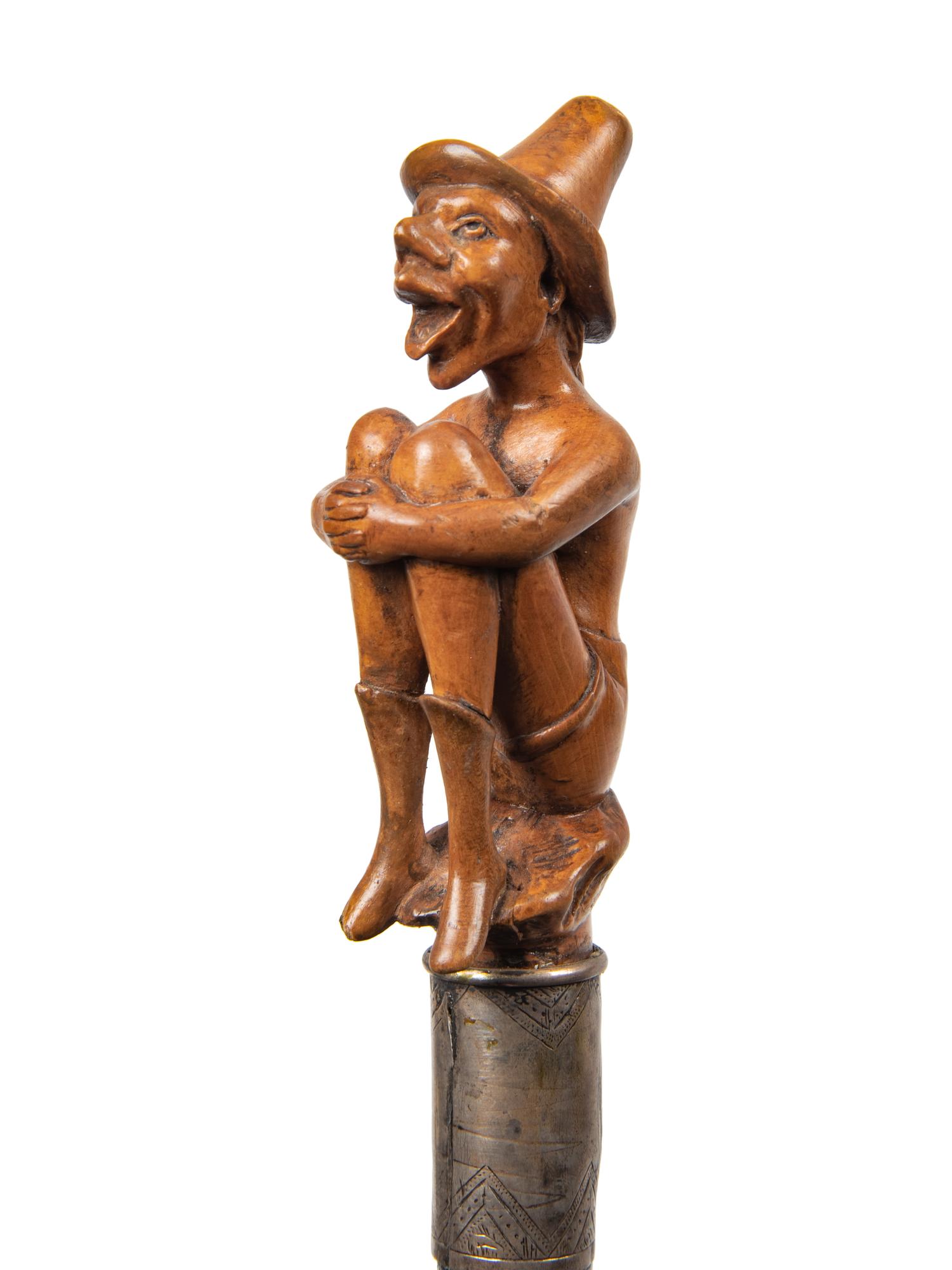 Three Continental Carved Wood Figural Canes