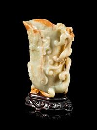 A Russet and Pale Celadon Jade 'Chilong' Rhyton Cup