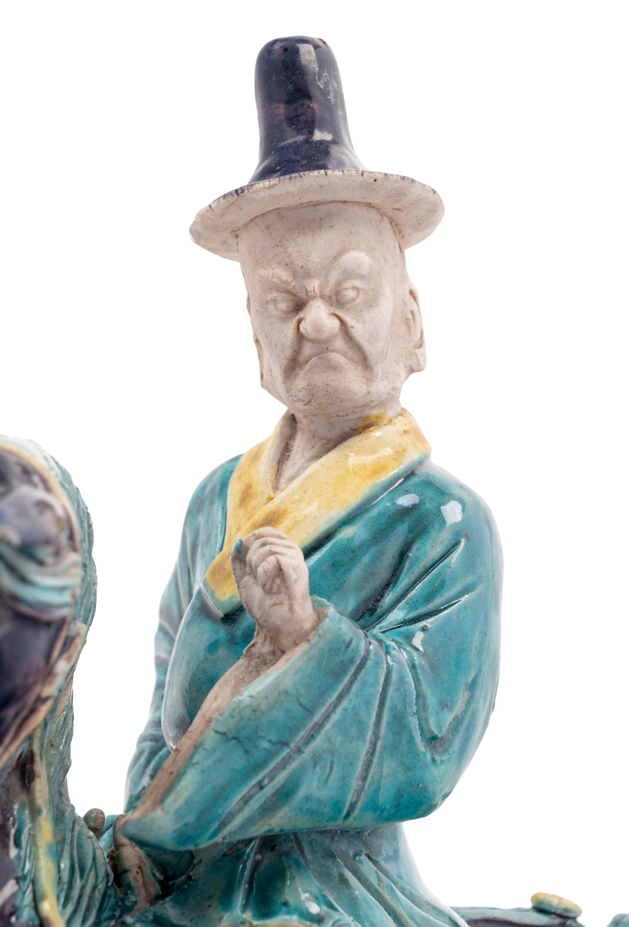 A Chinese Purple, Yellow and Blue Glazed Porcelain Equestrian Figure