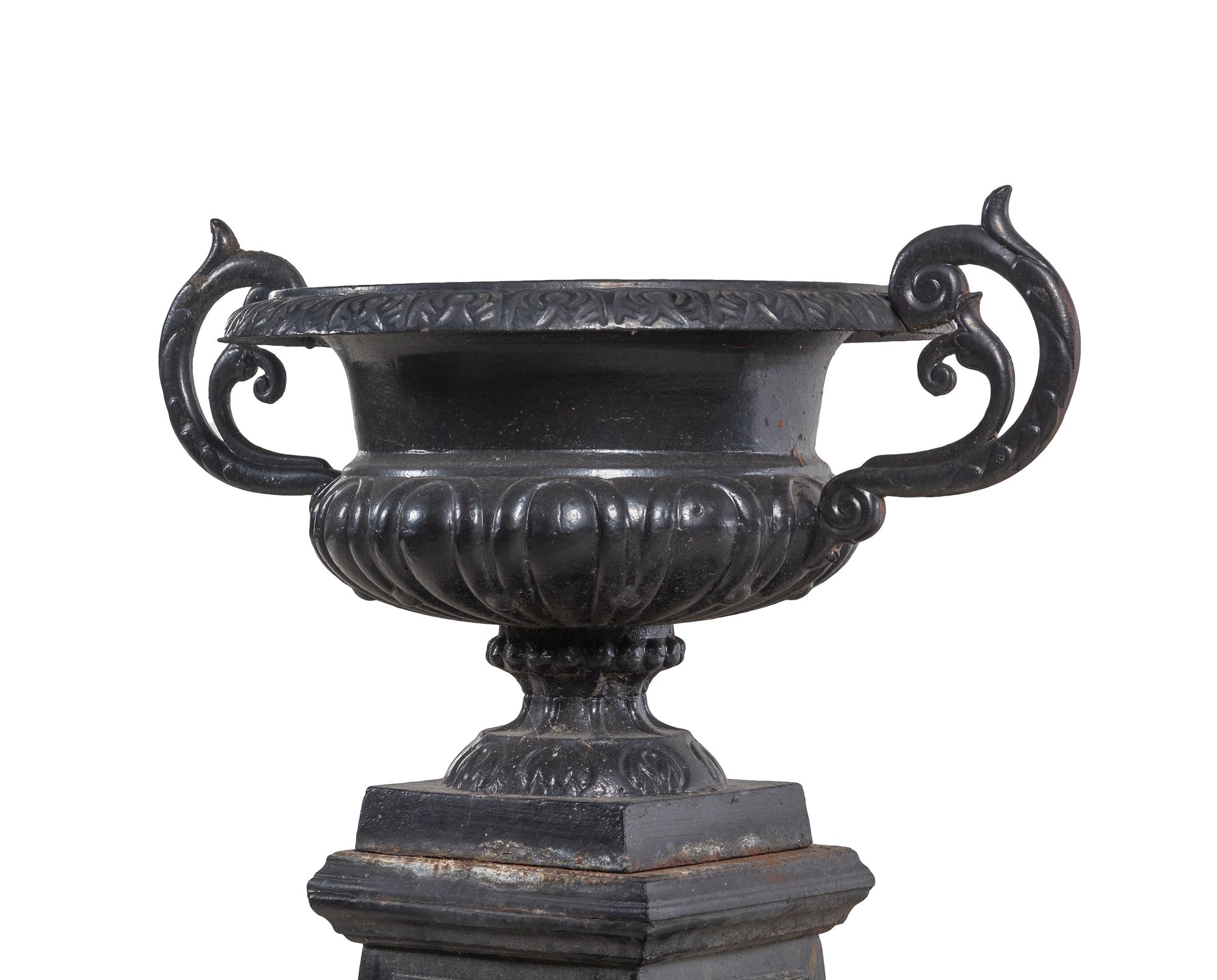 A Painted Cast Iron Garden Urn and Pedestal
