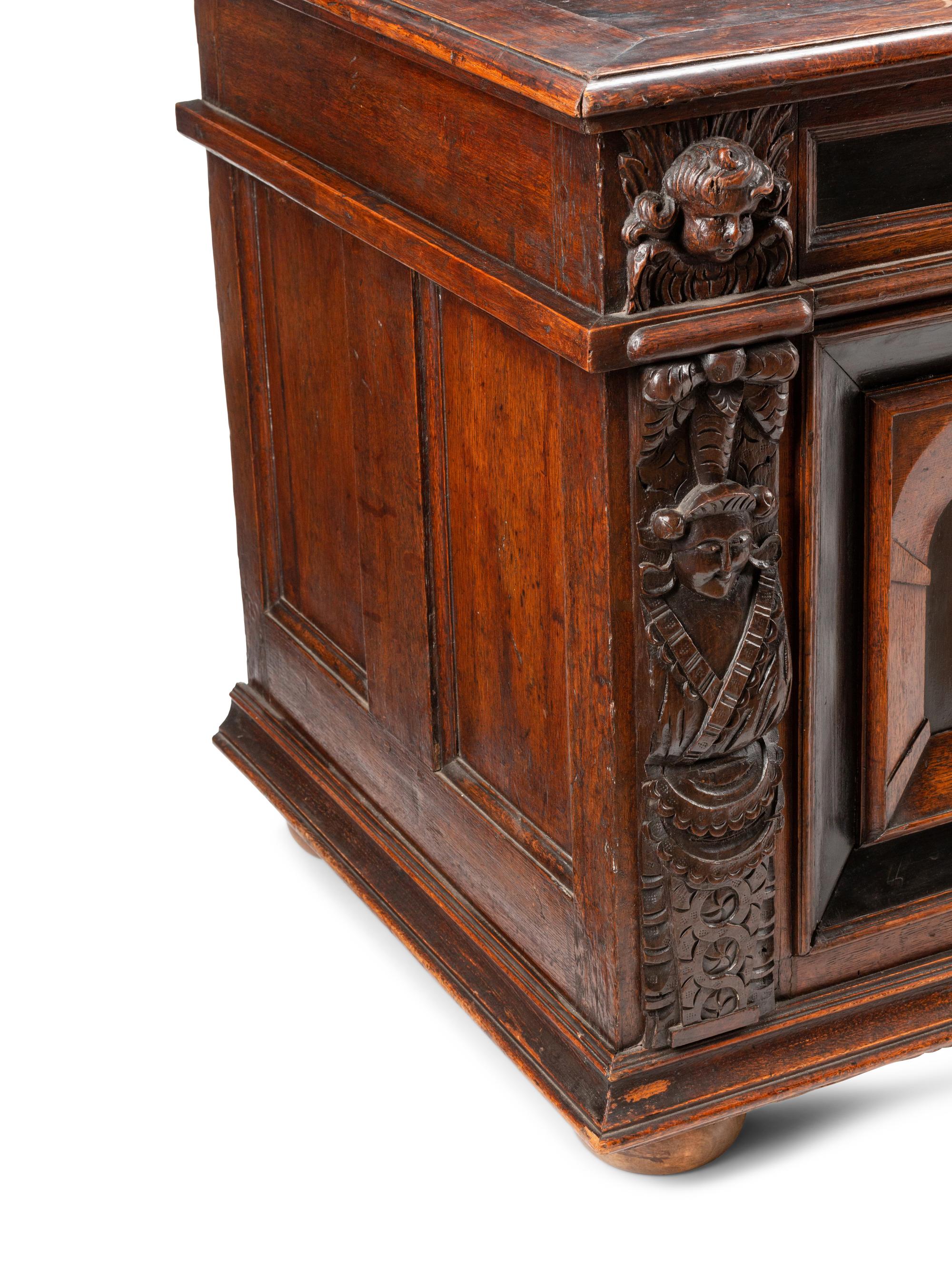 An Italian Carved Oak and Walnut Cassone