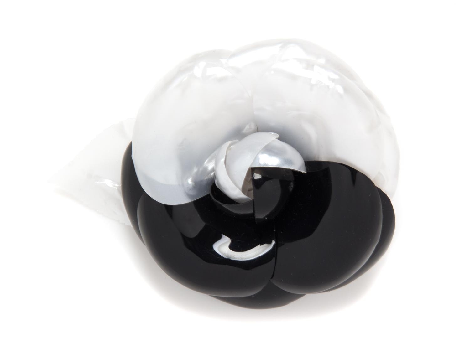 A Chanel Black and White Resin Brooch, 5" x 4".