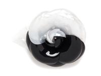 A Chanel Black and White Resin Brooch, 5" x 4".