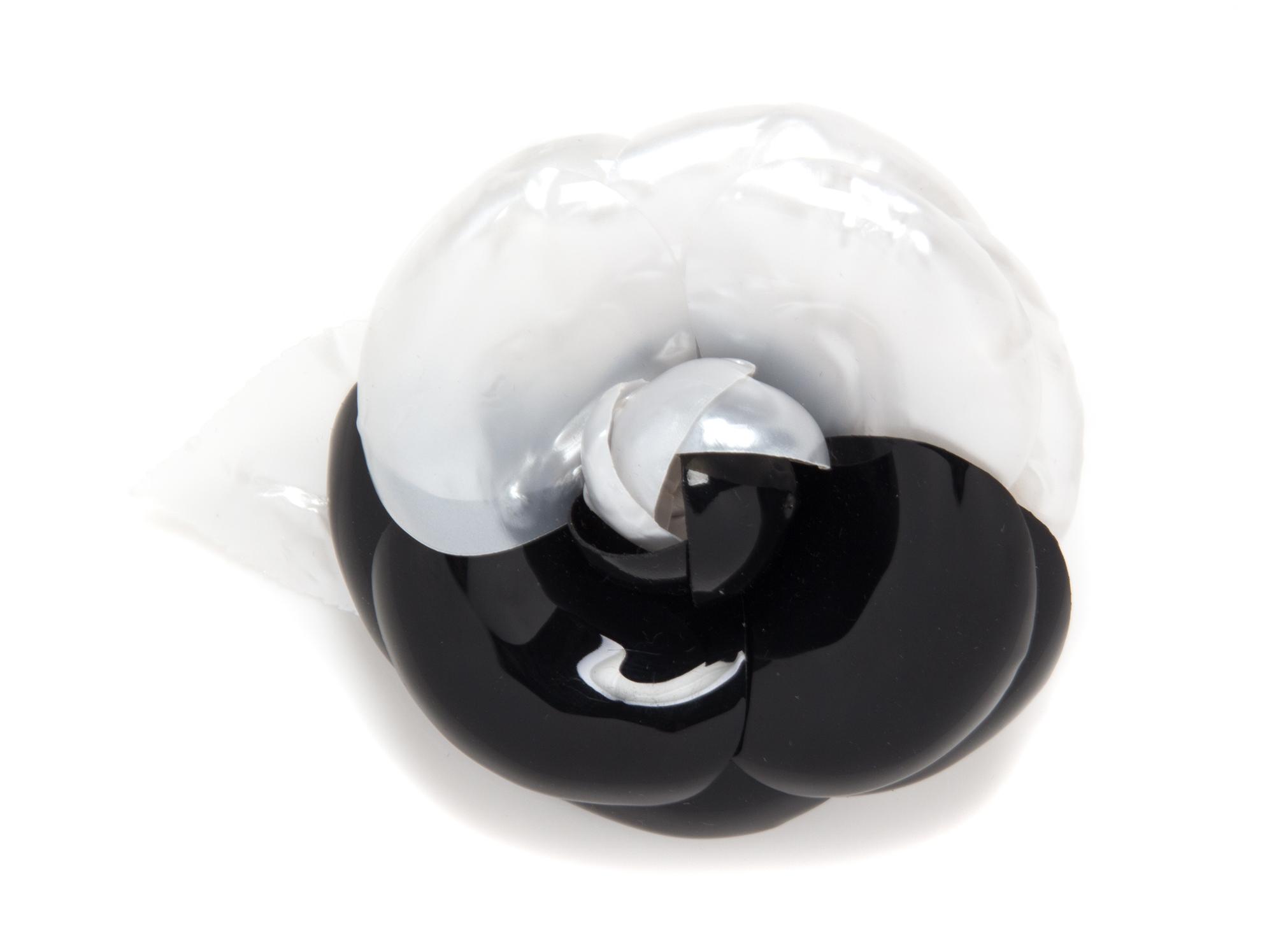 A Chanel Black and White Resin Brooch, 5" x 4".