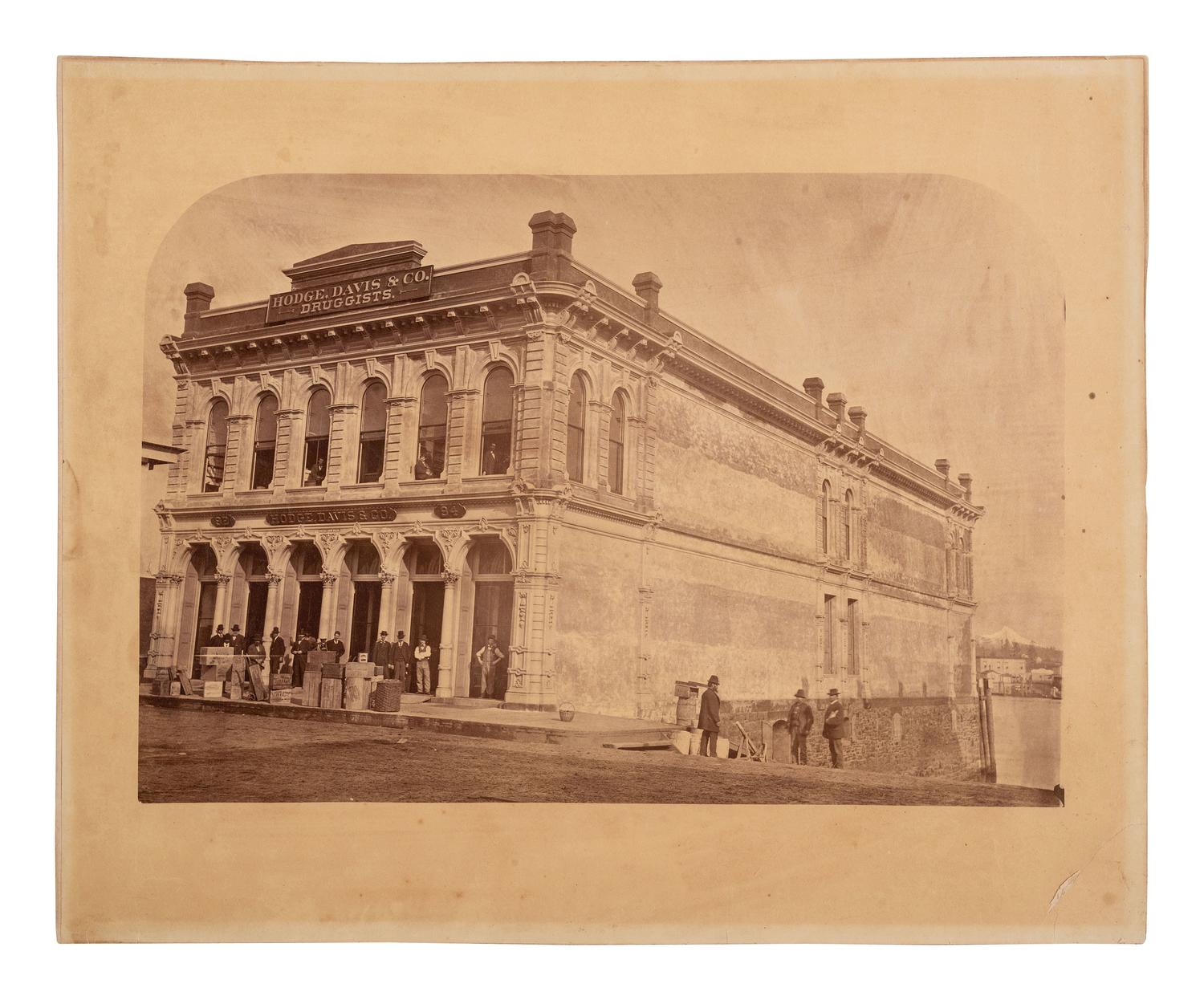 [EARLY PHOTOGRAPHY]. 2 large format photographs of storefronts, incl. Hodge, Davis & Co., Oregon.