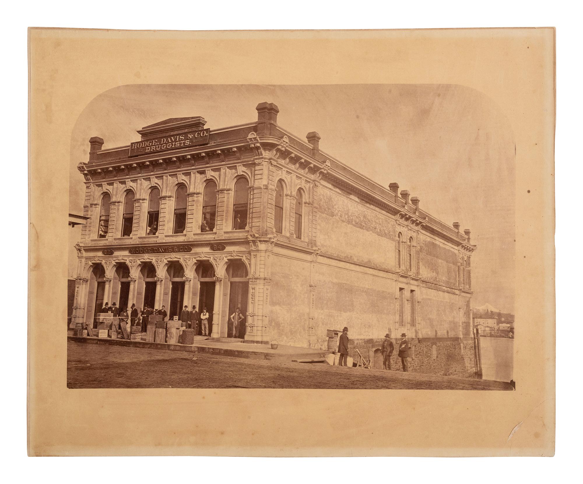 [EARLY PHOTOGRAPHY]. 2 large format photographs of storefronts, incl. Hodge, Davis & Co., Oregon.