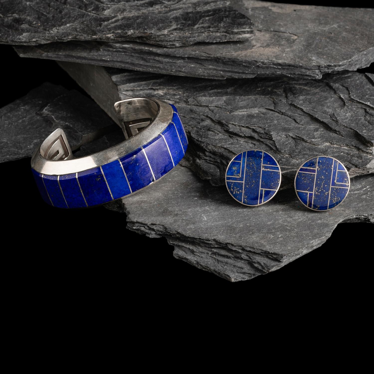 Michael L. Slim AND Knifewing Segura (Diné, act. since 1980s) AND (Chiricahua Apache, 20th century) — Sterling Silver and Lapis Cuff Bracelet and Post Earrings