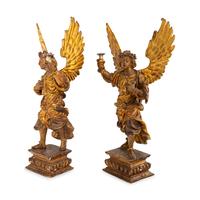 A Pair of Italian Painted and Parcel Gilt Figural Altar Prickets