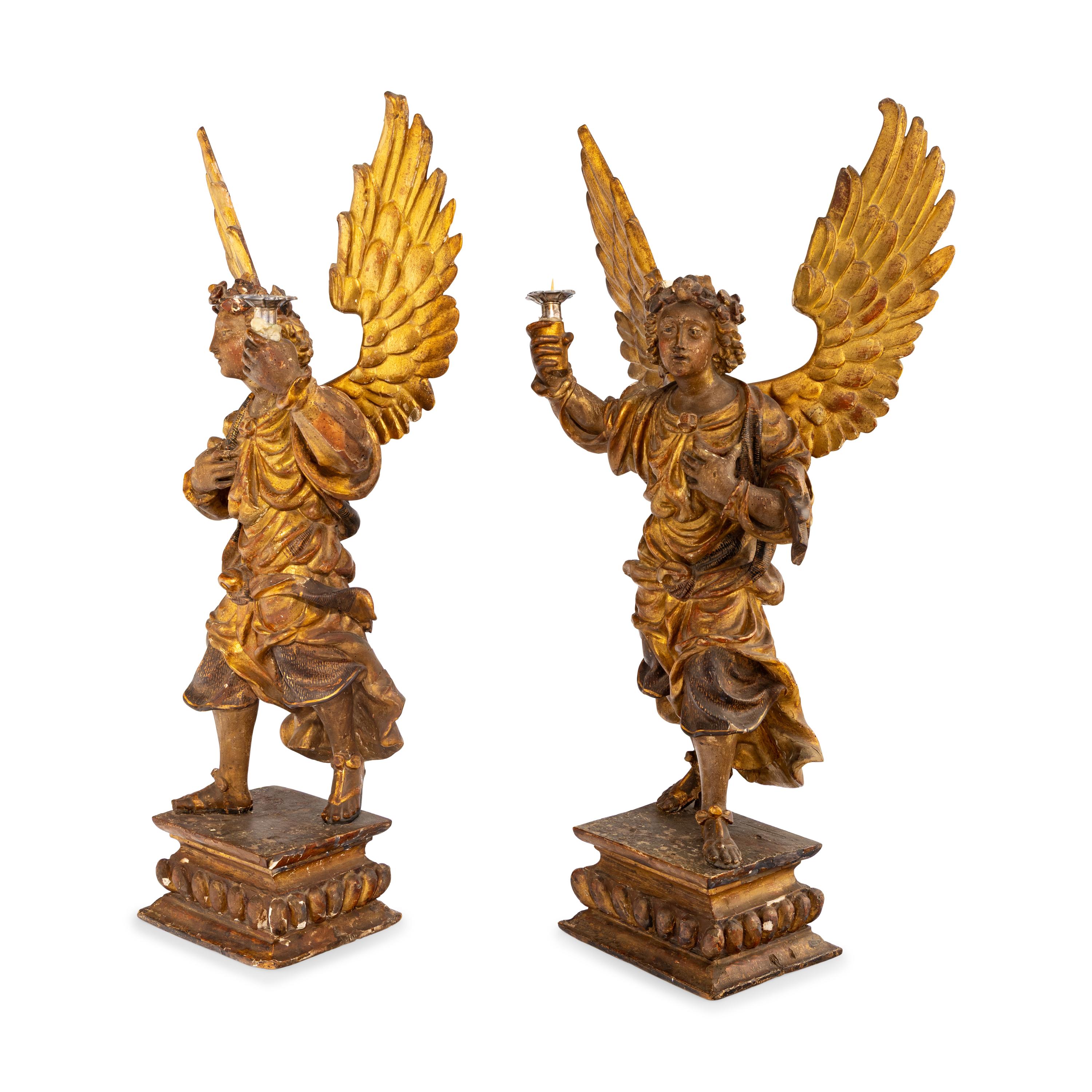 A Pair of Italian Painted and Parcel Gilt Figural Altar Prickets