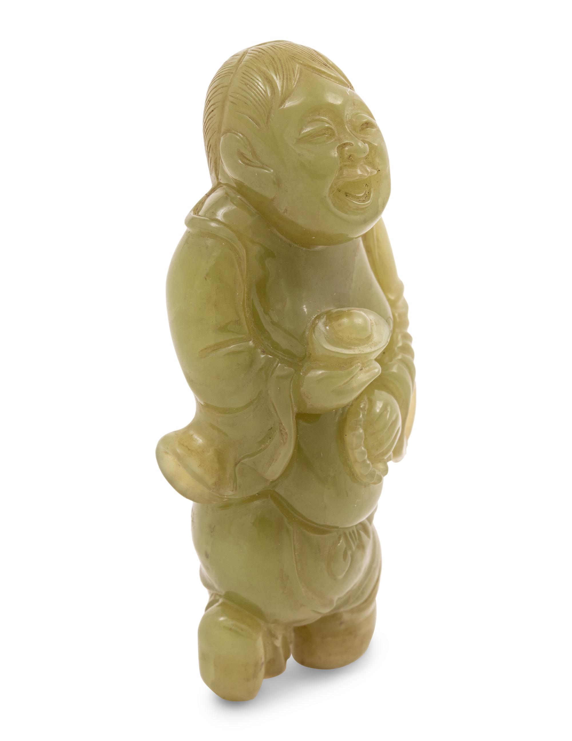 A Chinese Green Jade Figure of an Immortal