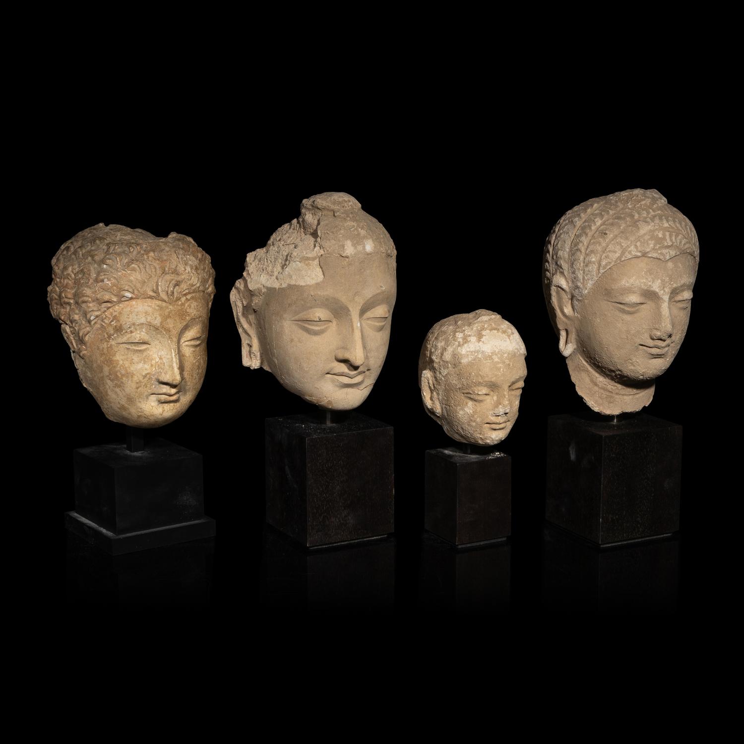 Four Gandharan Terracotta Heads of Buddha, 3rd-5th Century