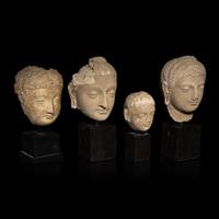 Four Gandharan Terracotta Heads of Buddha, 3rd-5th Century