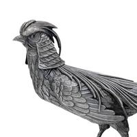 A Pair of Spanish Silver Pheasant Table Ornaments