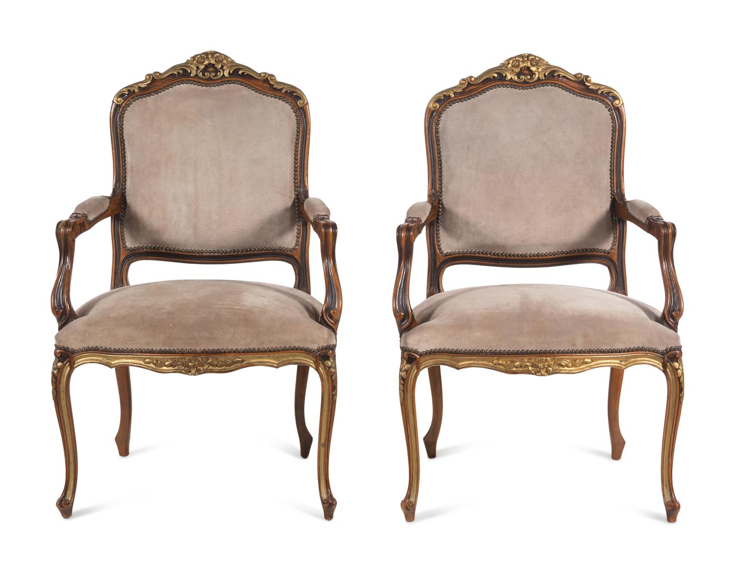 A Pair of Continental Parcel Gilt Armchairs with Suede Upholstery