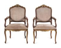 A Pair of Continental Parcel Gilt Armchairs with Suede Upholstery
