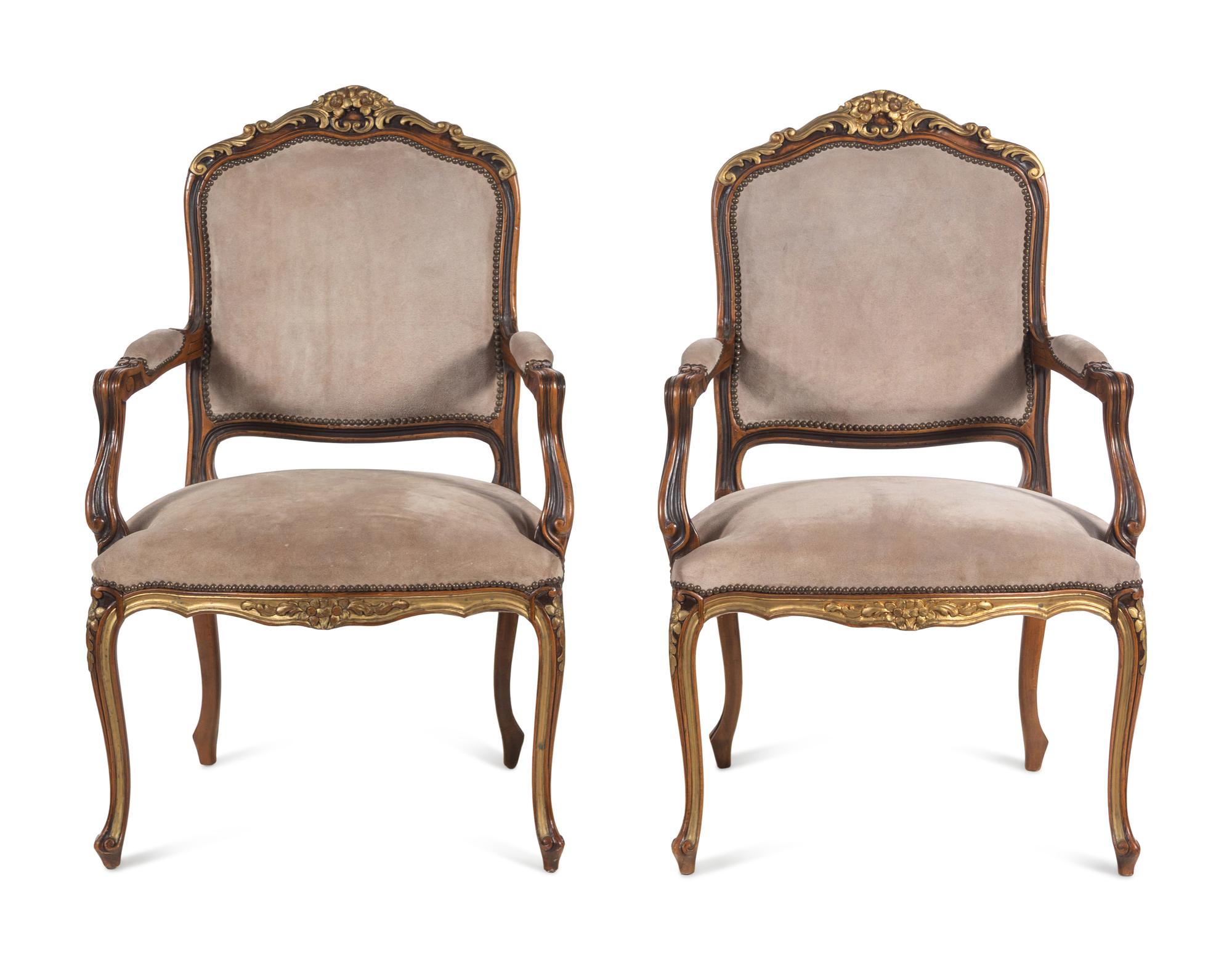 A Pair of Continental Parcel Gilt Armchairs with Suede Upholstery