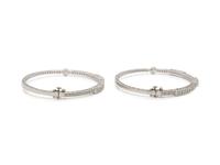 CHARIOL, PAIR OF WHITE GOLD AND DIAMOND BANGLE BRACELETS