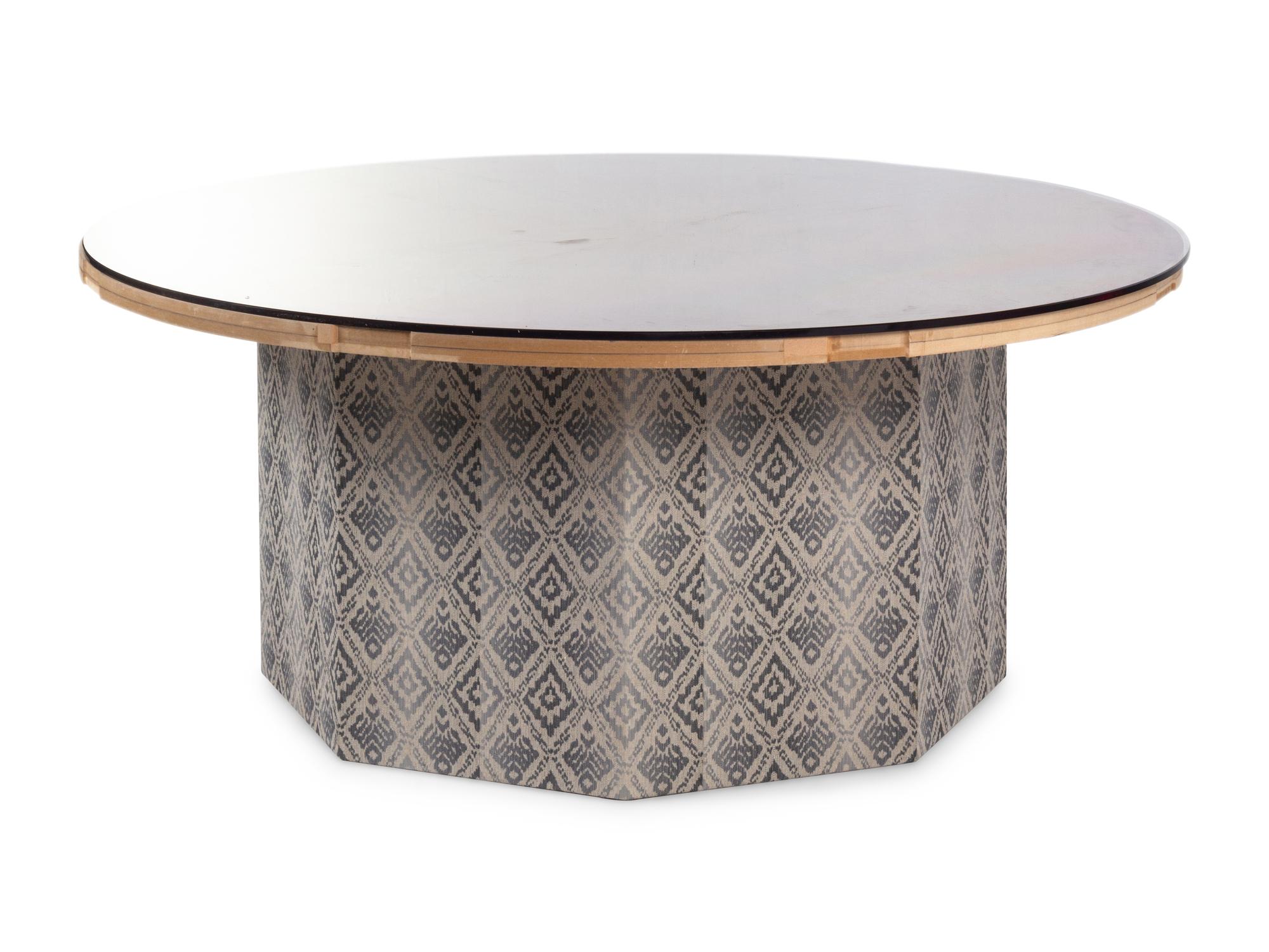 A Contemporary Octagonal Upholstered Dining Table Base with a Circular Glass Top