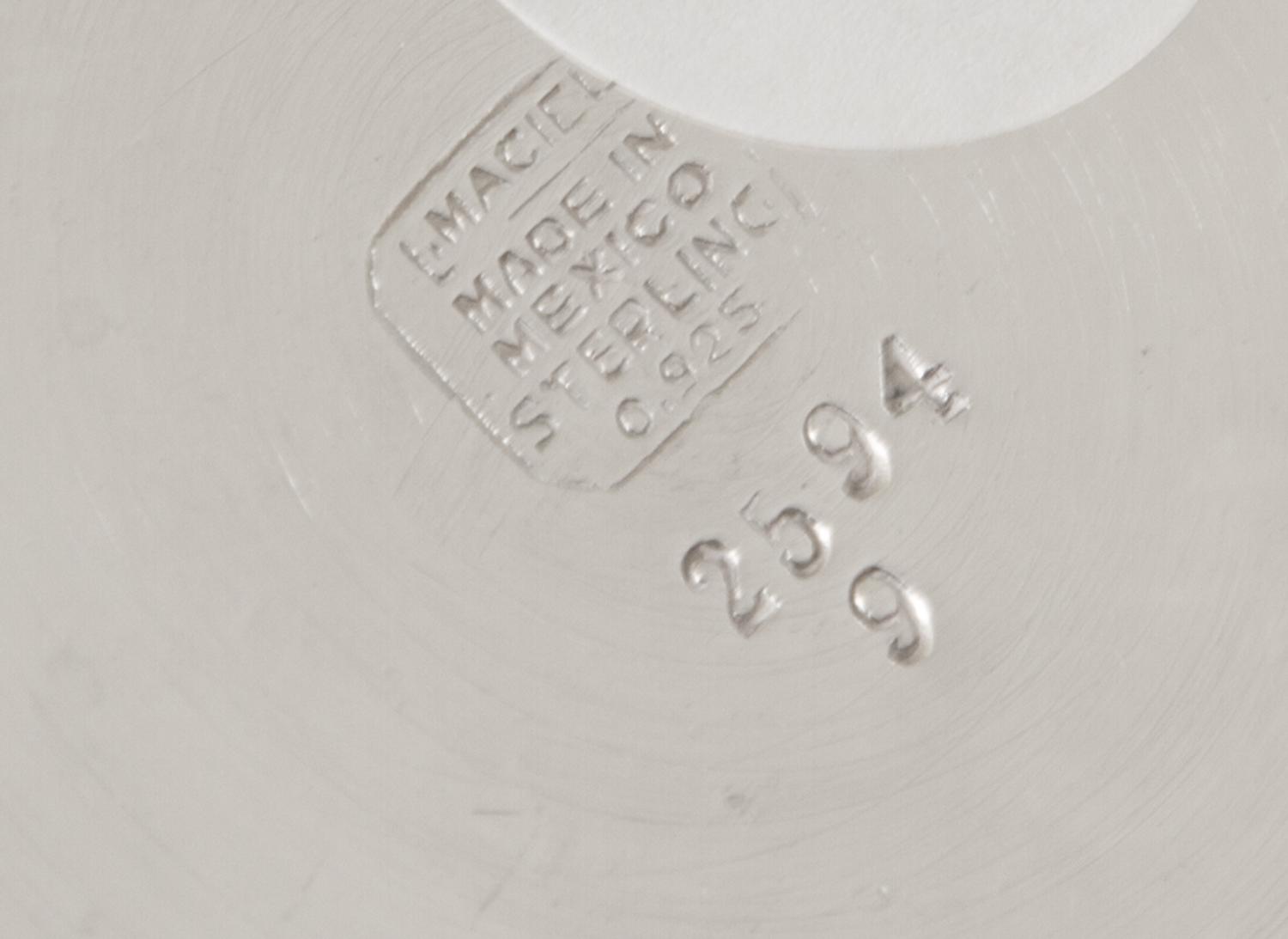 A Mexican Silver Beaker, L.Maciel, 20th Century, tapering, applied with a 1964 American Silver Kennedy Half-Dollar to one side.