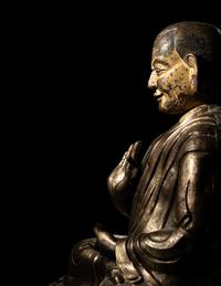 A Large Tibetan Parcel Gilt Bronze Repoussé Figure of a Seated Monk