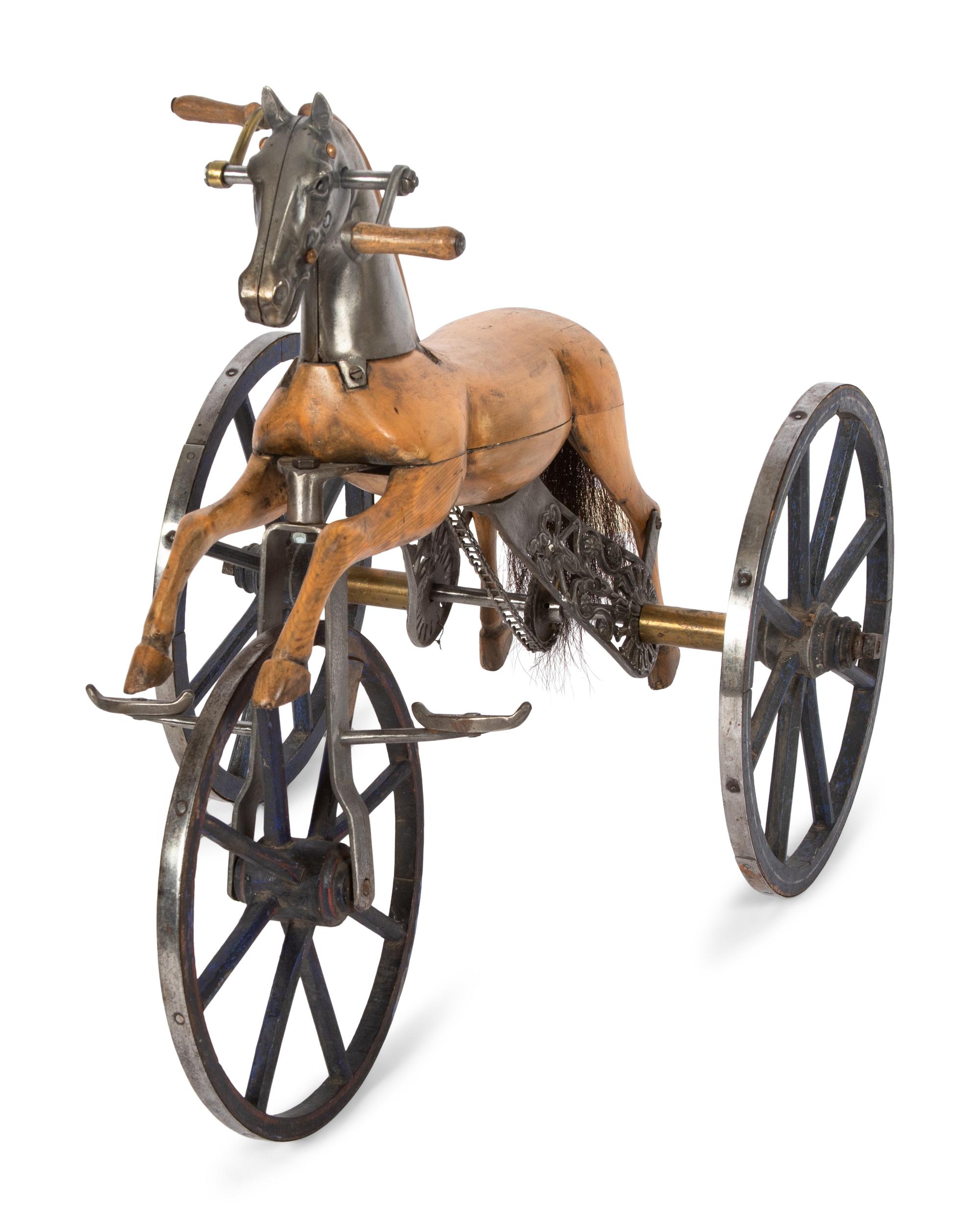 A Carved Wood and Cast Metal Tricycle