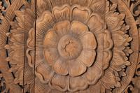 A Southeast Asian Carved Teakwood Mandala Panel