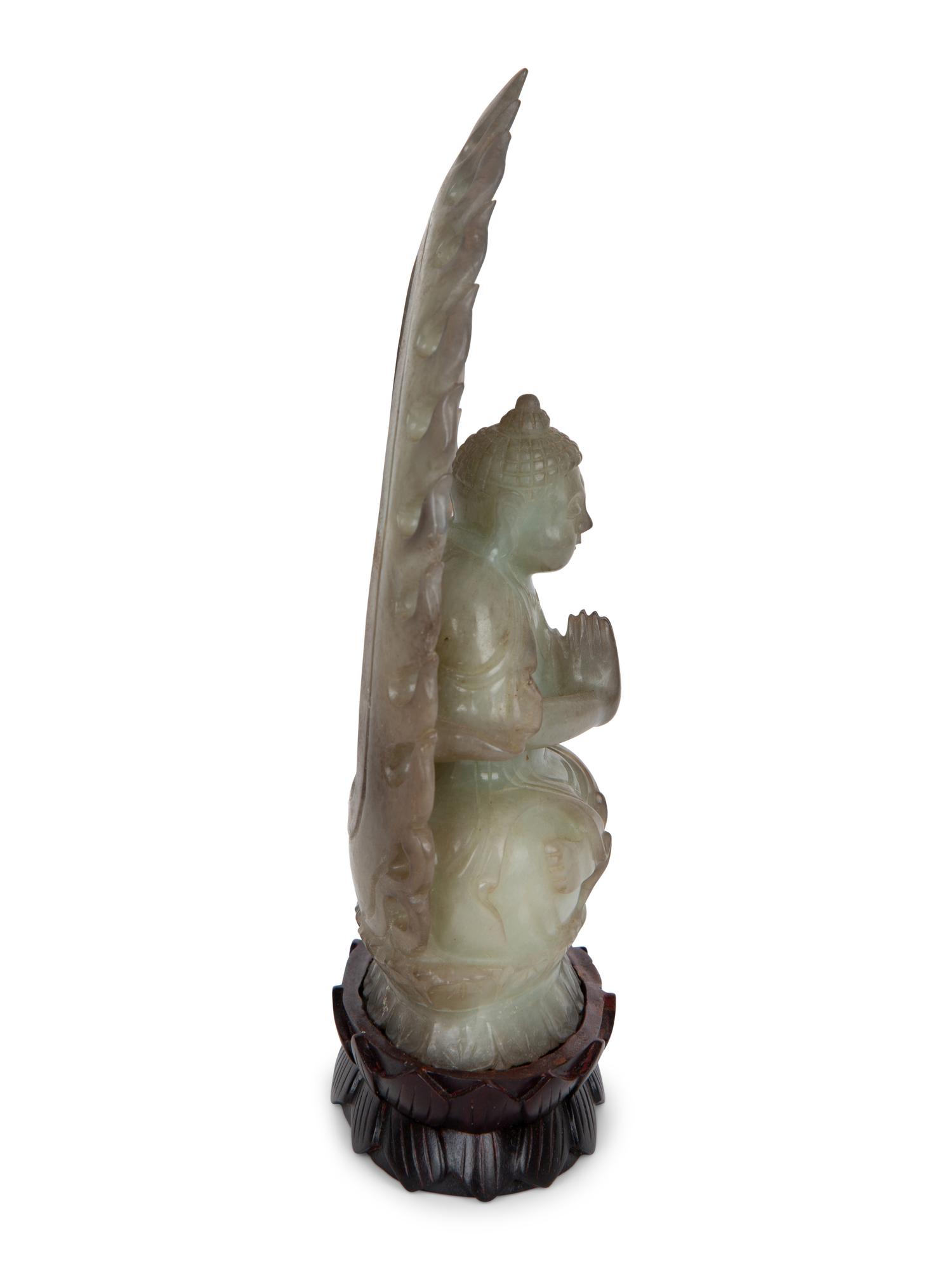 A Chinese Carved White Jade Seated Buddha Under Halo — 20TH CENTURY