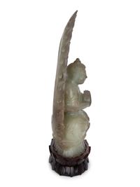 A Chinese Carved White Jade Seated Buddha Under Halo — 20TH CENTURY