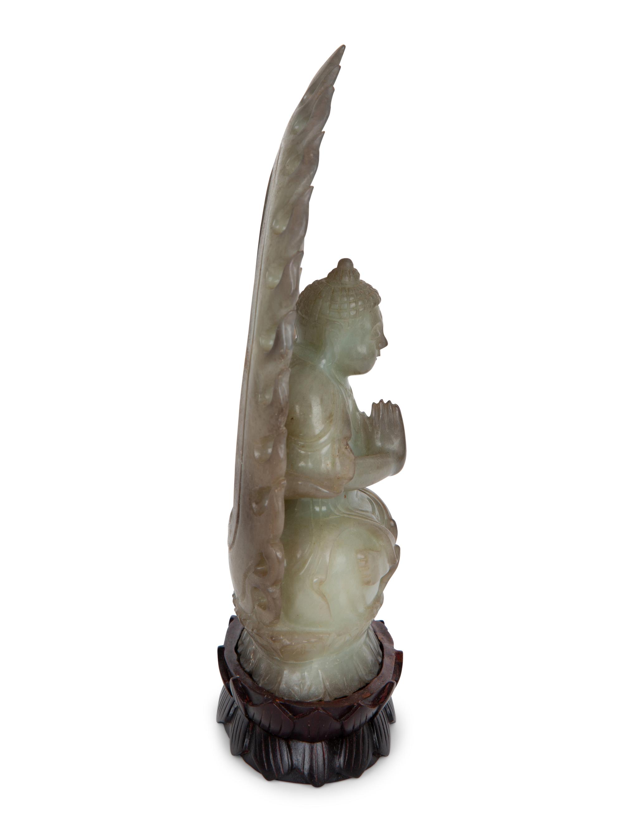 A Chinese Carved White Jade Seated Buddha Under Halo — 20TH CENTURY