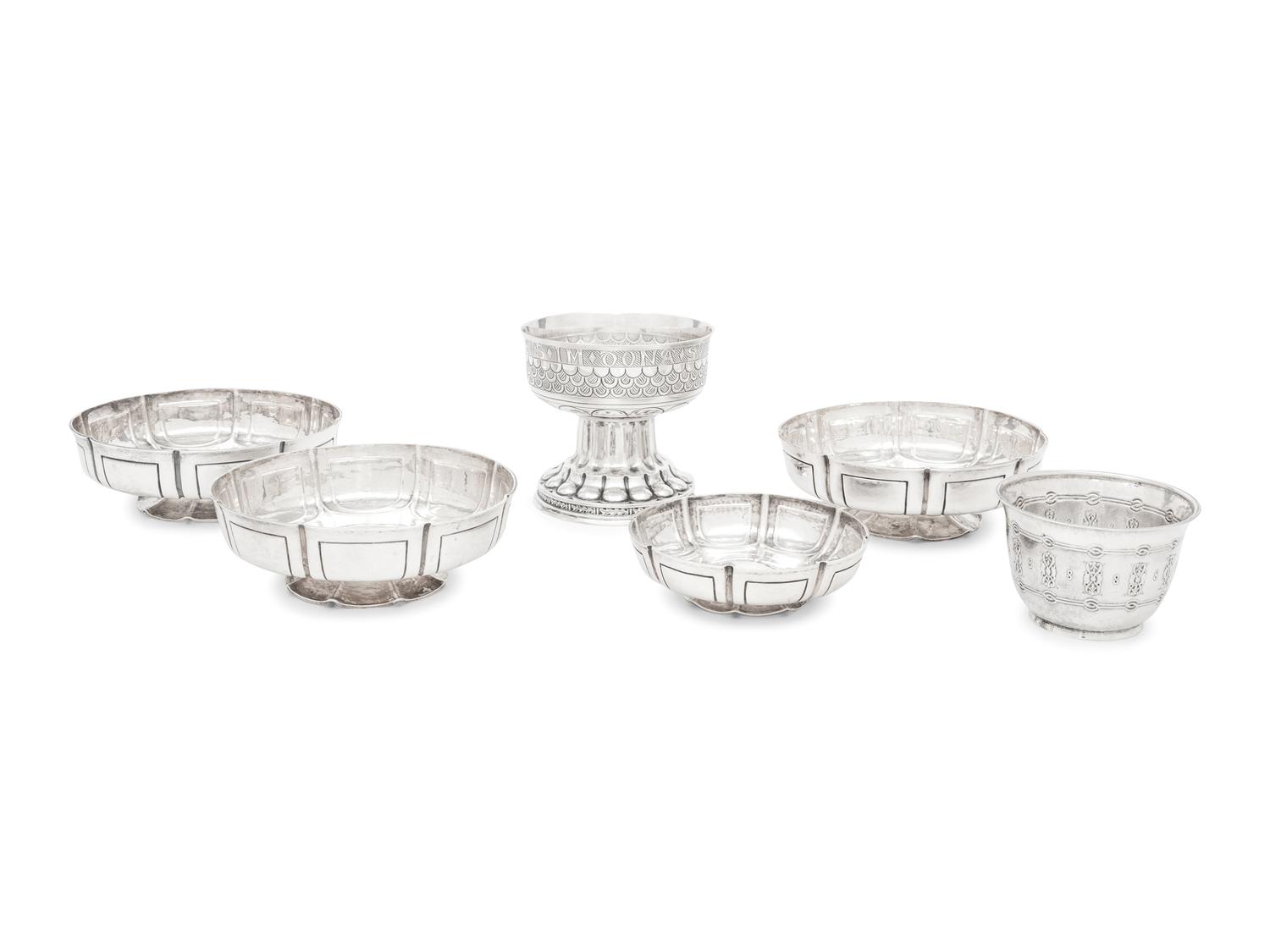 A Group of Six English Arts and Crafts Silver Table Articles