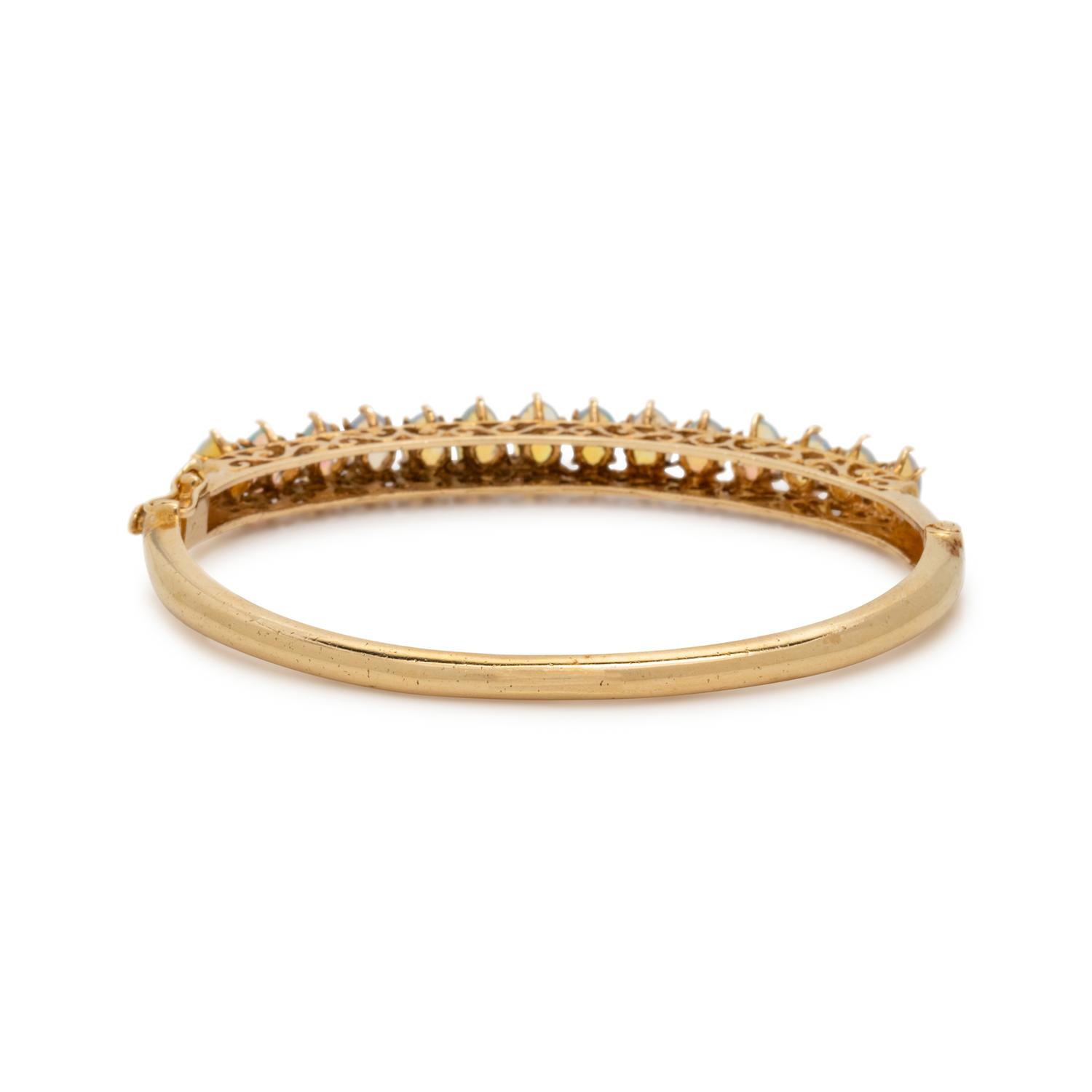 YELLOW GOLD AND OPAL BANGLE BRACELET