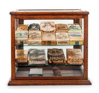 A Collection of Fifteen Tobacco Cartons and a Tobacco Rope in Display Case
