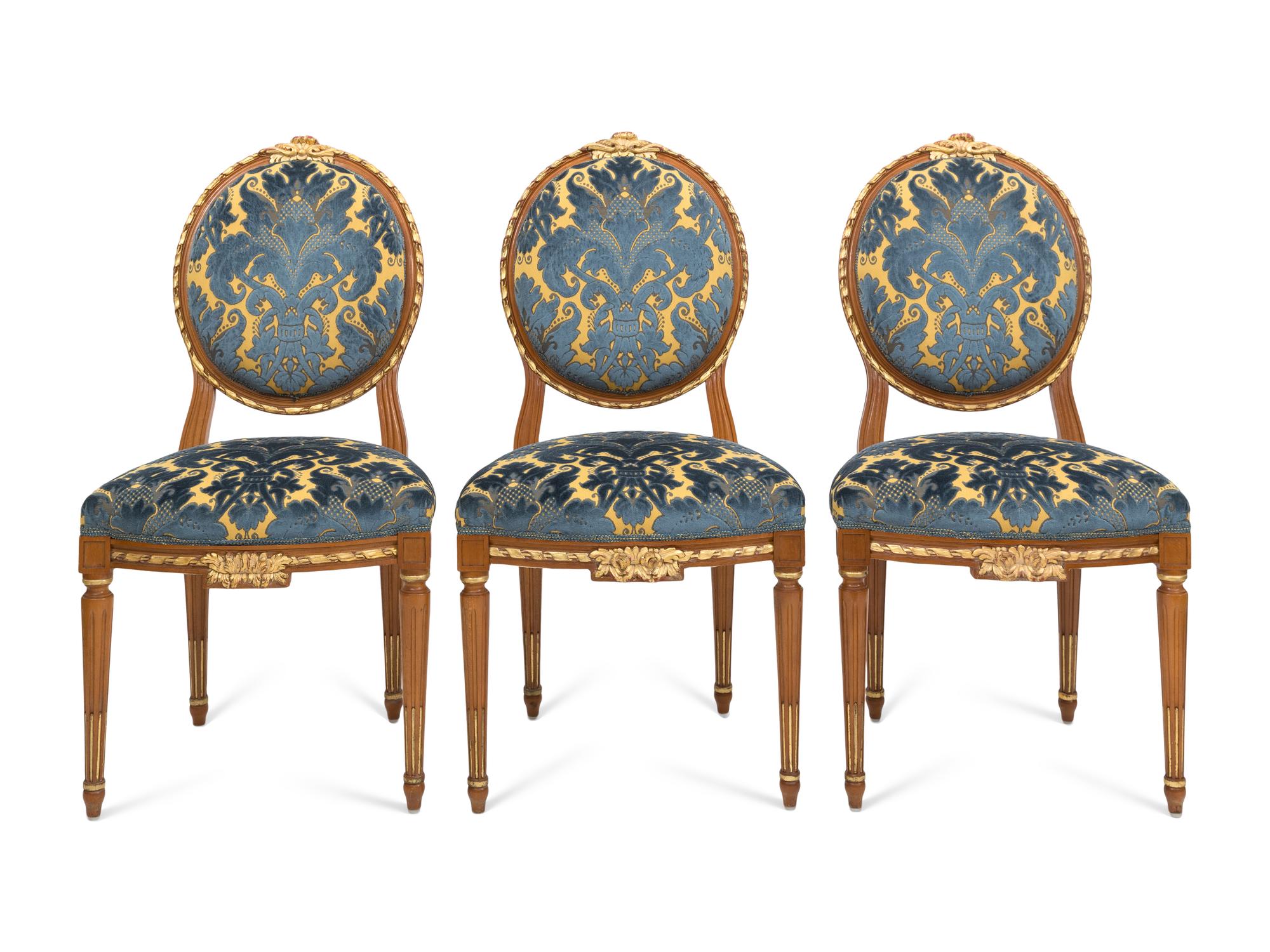 A Set of Three Italian Parcel Gilt Side Chairs