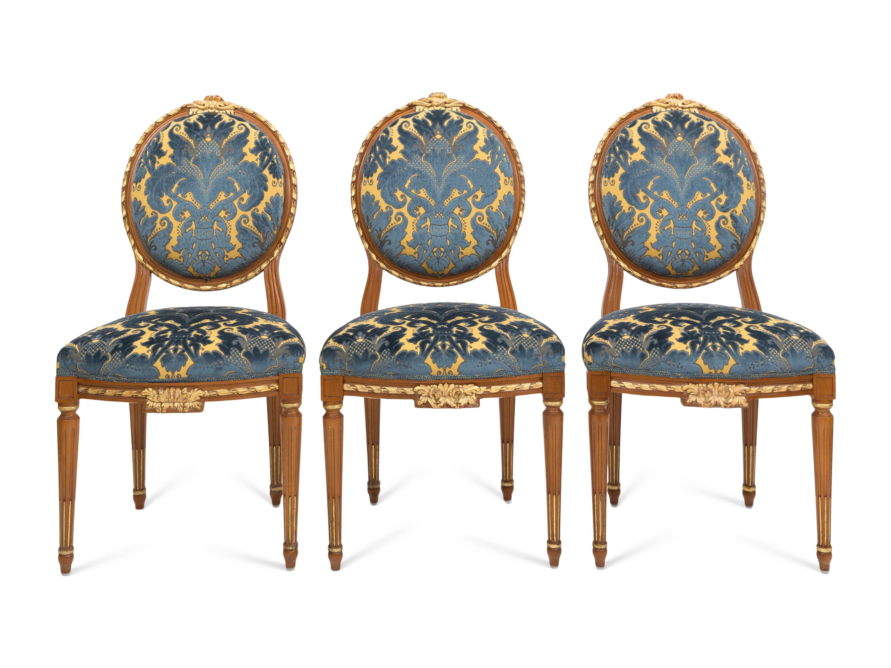A Set of Three Italian Parcel Gilt Side Chairs