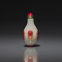 A Chinese Miniature Red-Overlaid Opaline Glass Snuff Bottle, Circa 1750-1820 1750-1820年 涅白地套寶石紅料螭龍紋小鼻烟壺