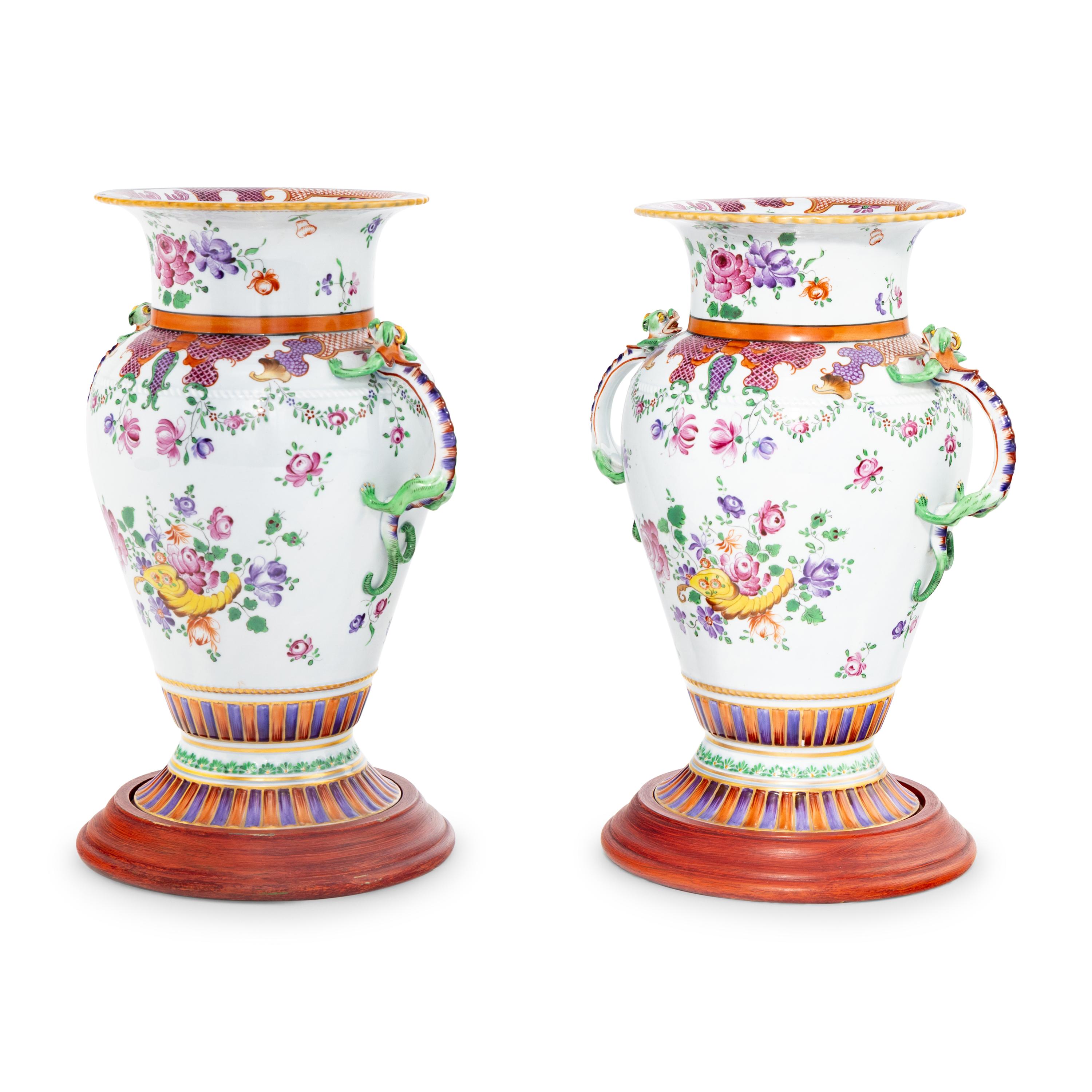 A Pair of Porcelain Urns with Dragon Handles