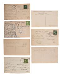 [EARLY PHOTOGRAPHY]. A group of 42 real photo postcards of cityscapes, town activities and disasters, parades, circuses, and fairs, highlighted by view of a child labor protest, an elephant parade, and bronco busting.