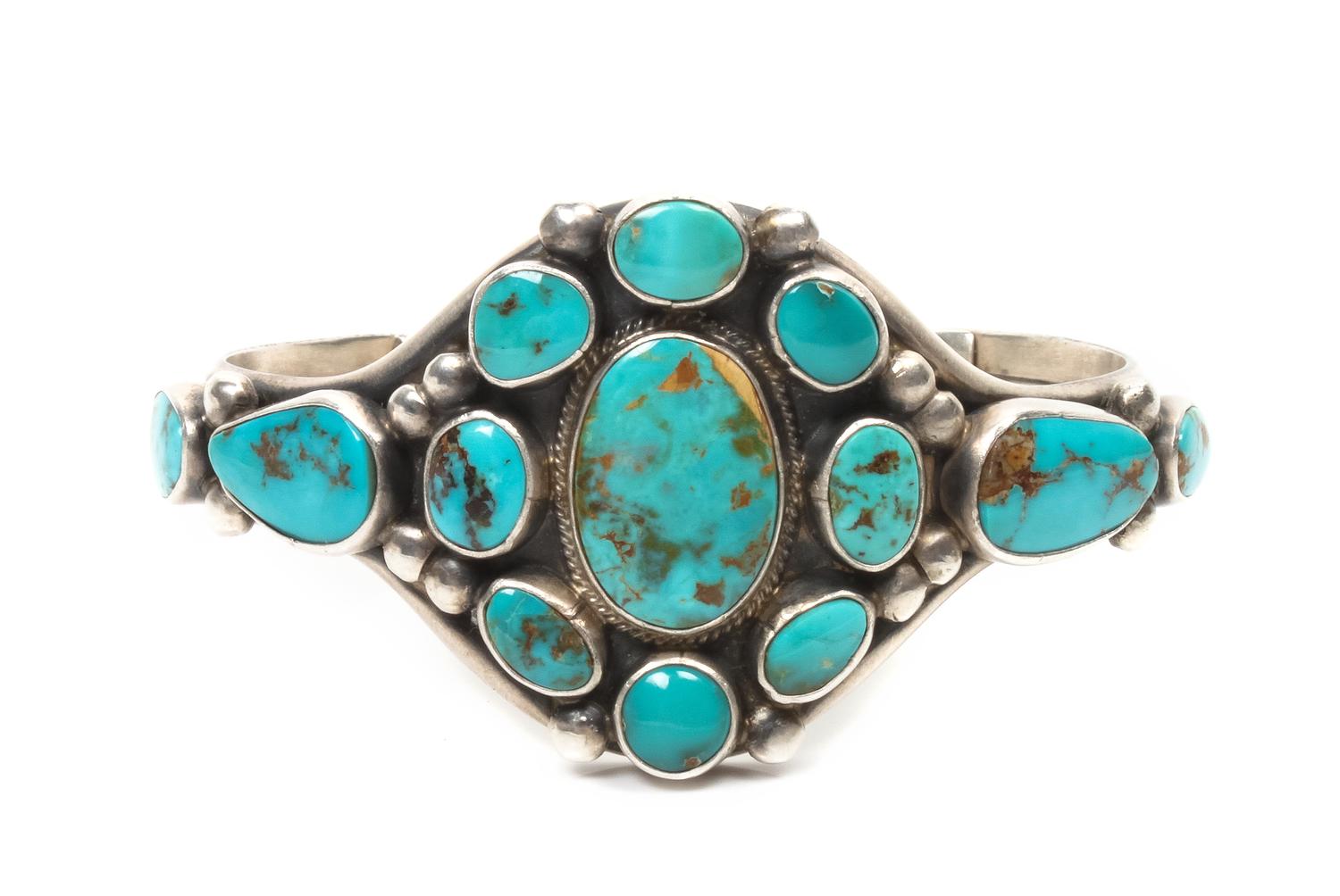 A Navajo Silver and Turquoise Cluster Bracelet, Verdy Jake, Length 6 plus opening 1 1/4 x width 1 3/8 inches.