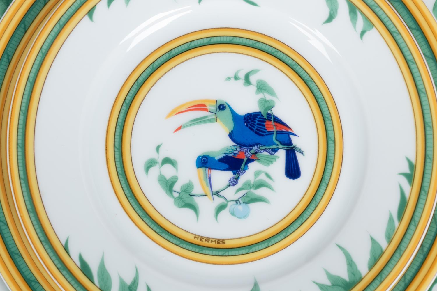 An Hermès Porcelain Toucans Porcelain Dinner Service