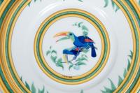 An Hermès Porcelain Toucans Porcelain Dinner Service