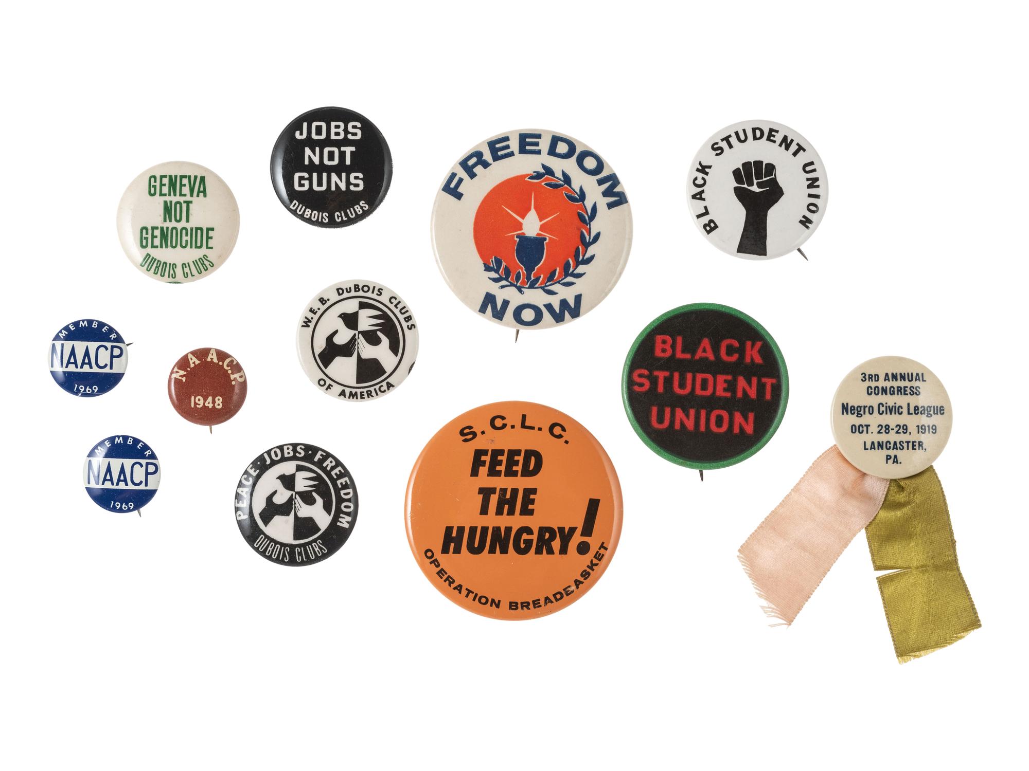 [CIVIL RIGHTS]. A group of 12 pinback buttons promoting various Civil Rights organizations incl. the NAACP, SCLC, CORE, and others.