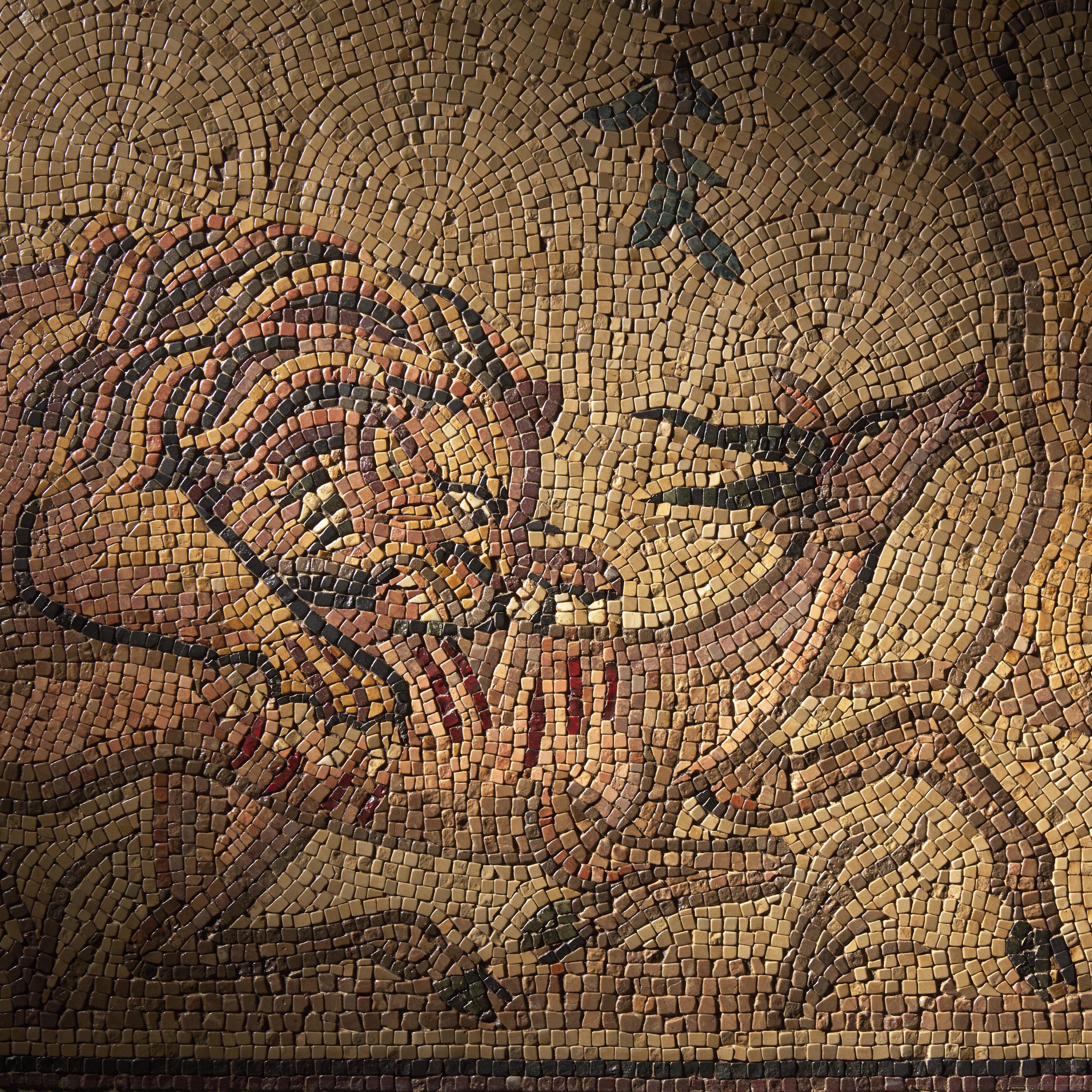 A Roman Style Stone Mosaic Panel with a Lion Hunting Prey