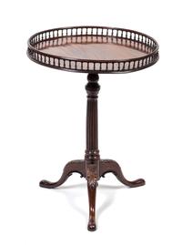 A George III Mahogany Tea Table Height 30 1/2 x diameter 22 1/2 inches.