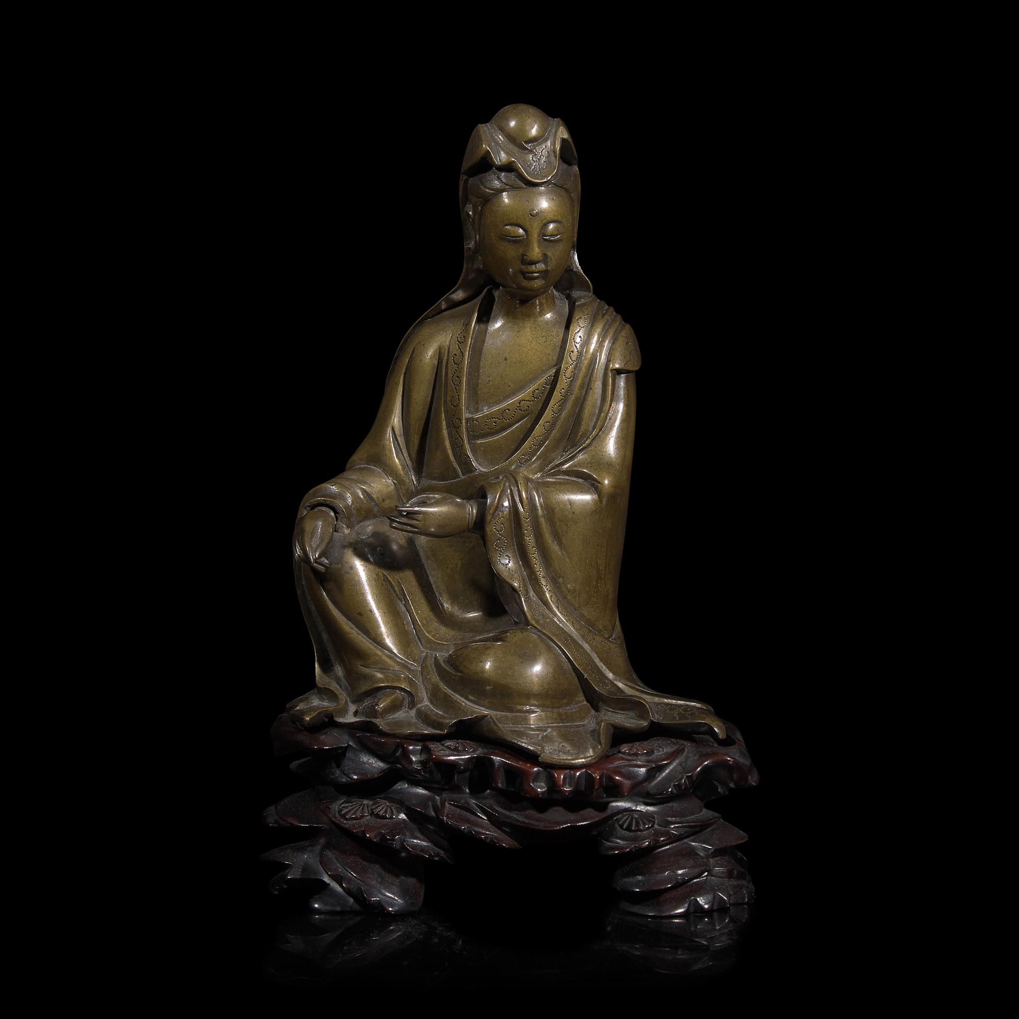 A Patinated Bronze Figure of Guanyin 銅加漆觀音 帶木座