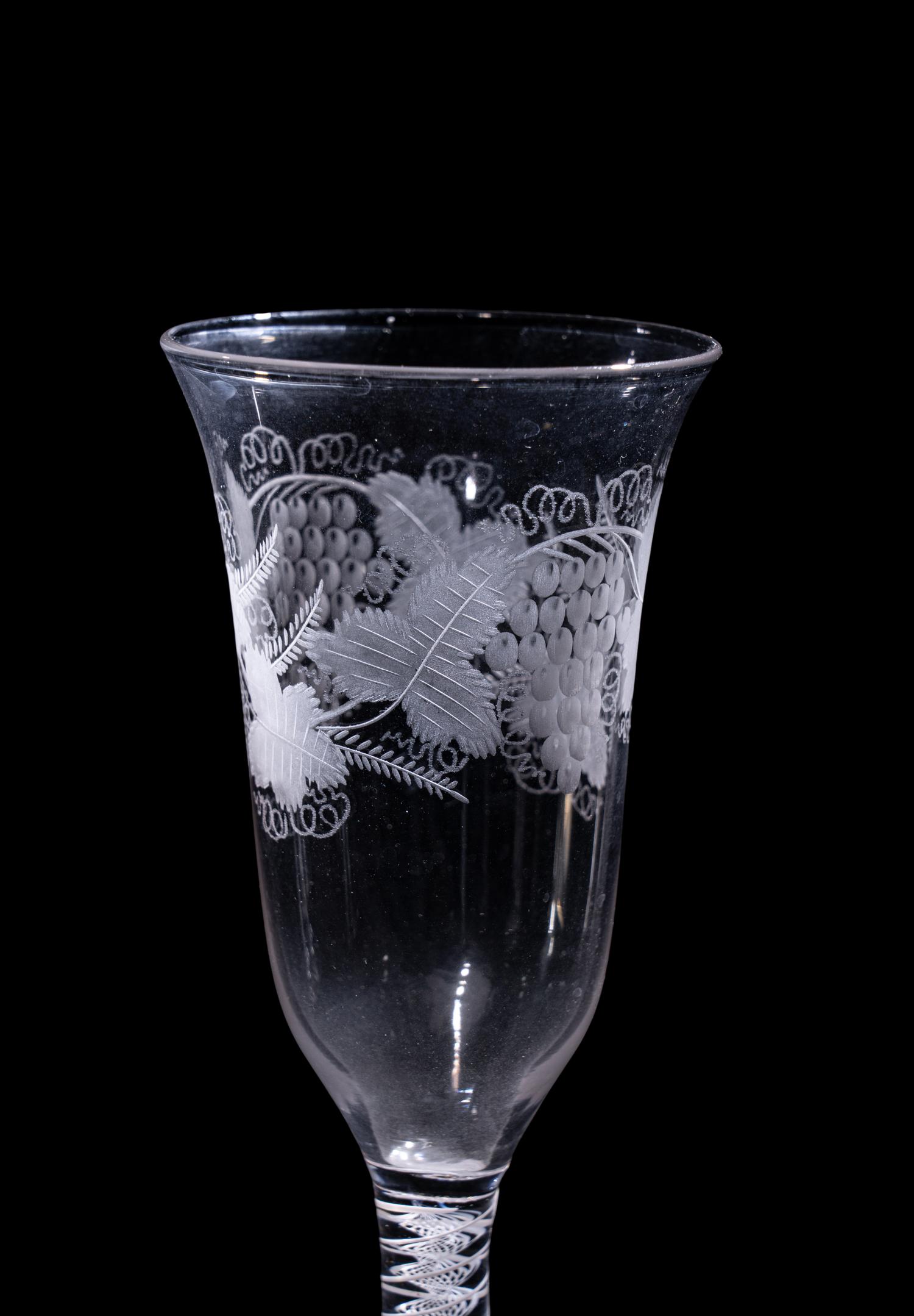 A Set of Seven Engraved Glass Cordials with Twist Stems