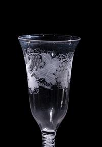 A Set of Seven Engraved Glass Cordials with Twist Stems